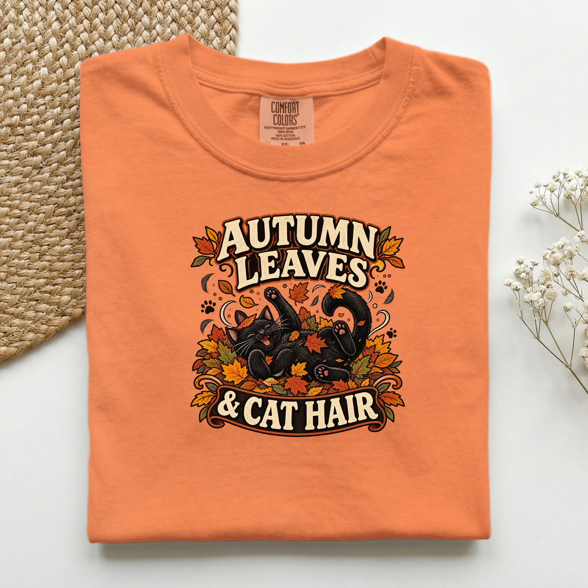 Autumn Leaves & Cat Hair graphic tee in Burnt Orange, folded flat lay