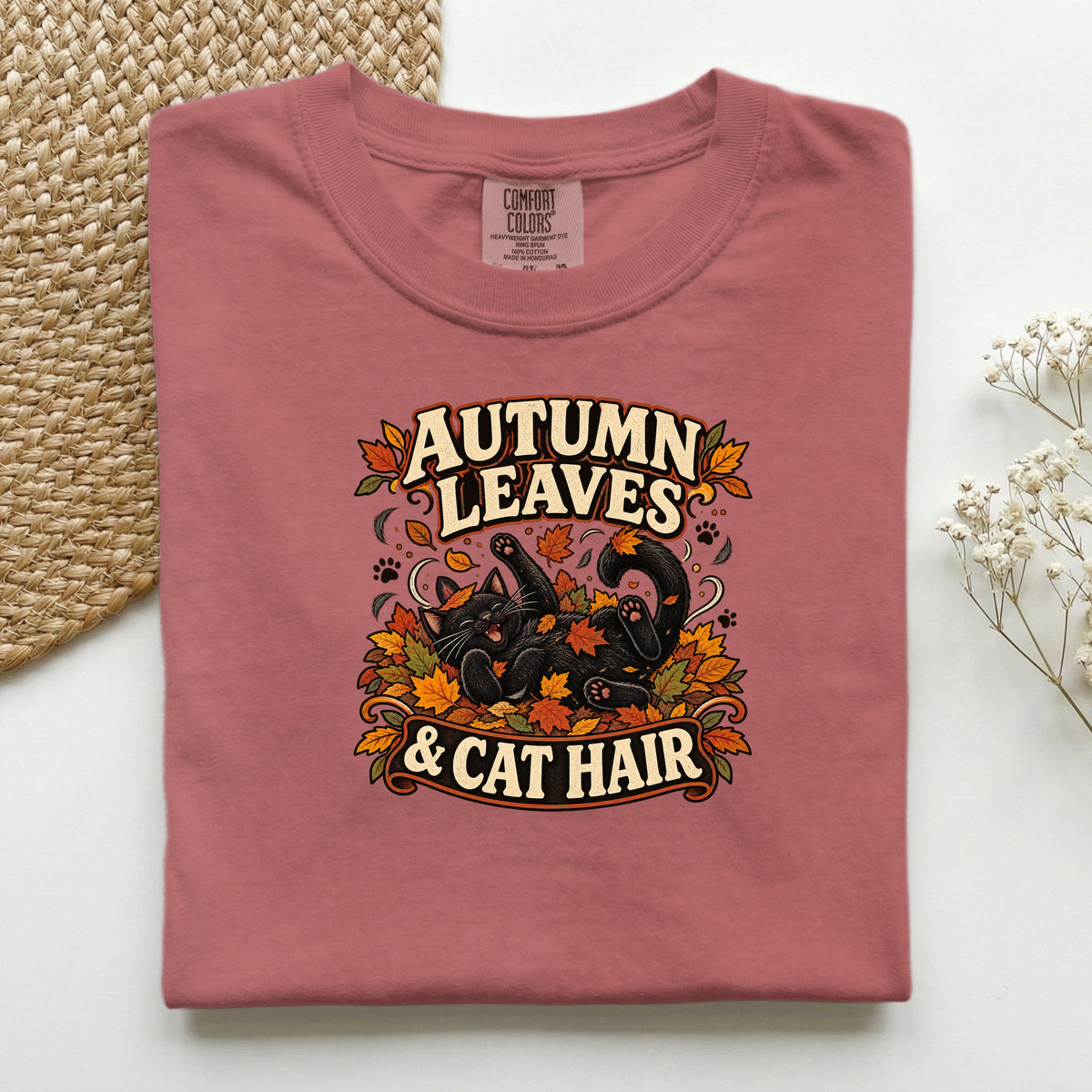 Autumn Leaves & Cat Hair graphic tee in Crimson, folded flat lay