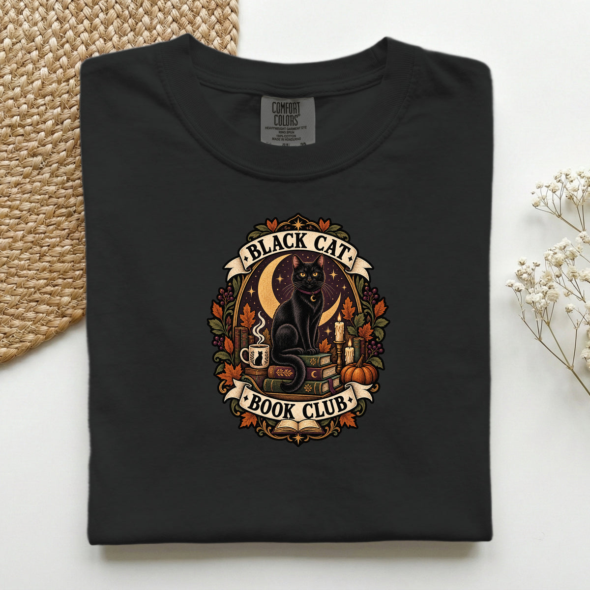 Black Cat Book Club graphic tee in Black, folded flat lay
