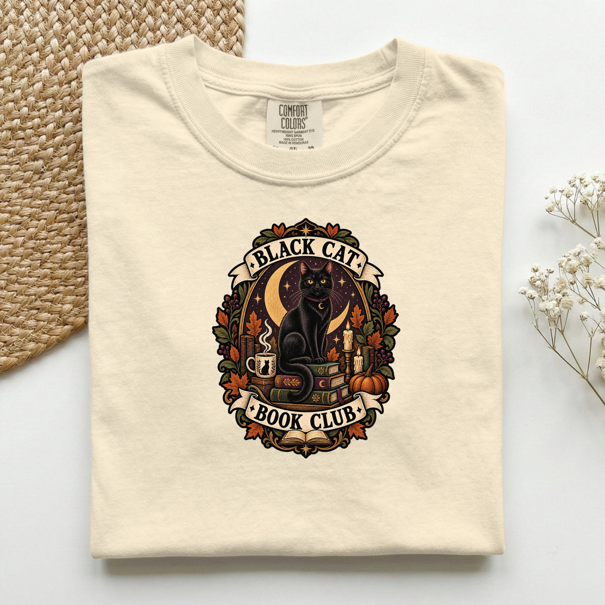 Black Cat Book Club graphic tee in Ivory, folded flat lay