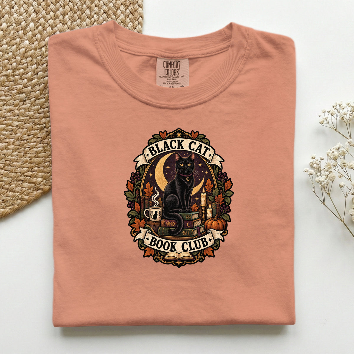 Black Cat Book Club graphic tee in Terracotta, folded flat lay