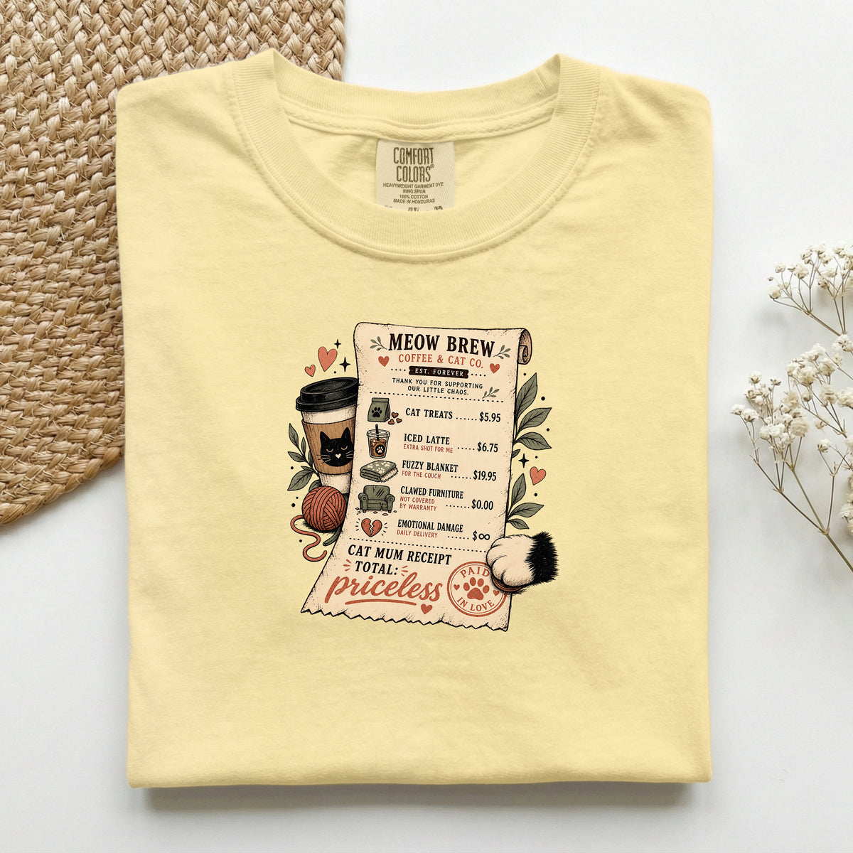 Meow Brew Receipt graphic tee in Butter, folded flat lay