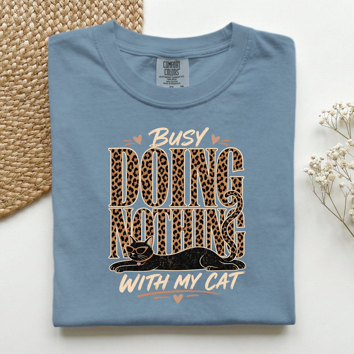 Busy Doing Nothing With My Cat graphic tee in Blue Jean, folded flat lay