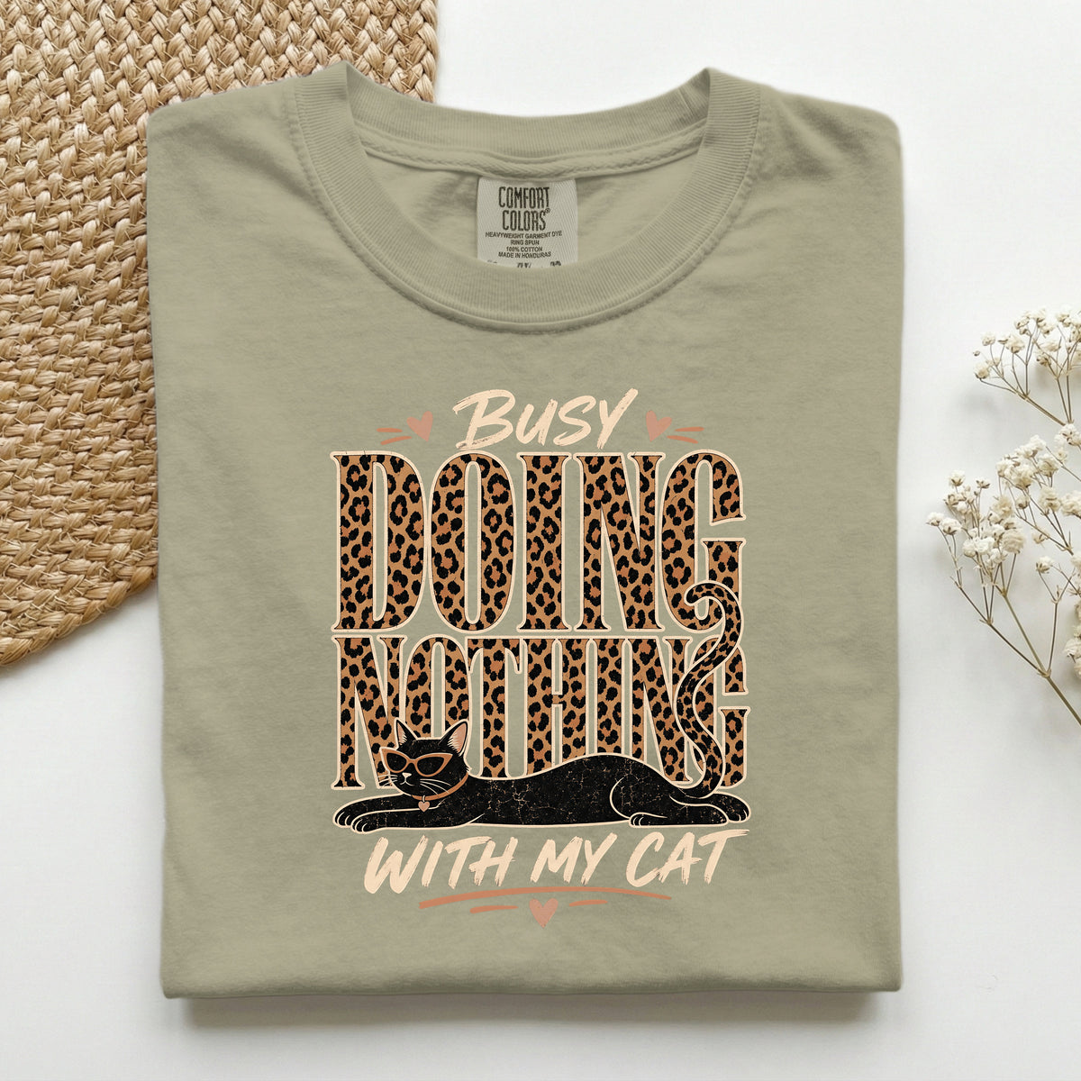 Busy Doing Nothing With My Cat graphic tee in Khaki, folded flat lay