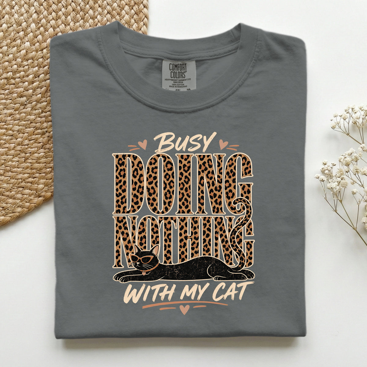 Busy Doing Nothing With My Cat graphic tee in Pepper, folded flat lay