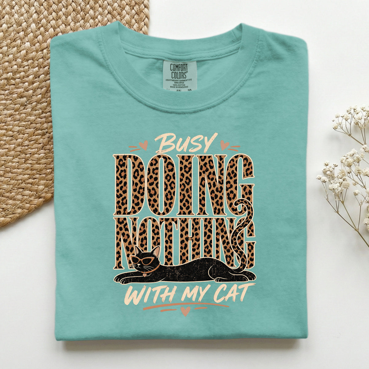 Busy Doing Nothing With My Cat graphic tee in Seafoam, folded flat lay