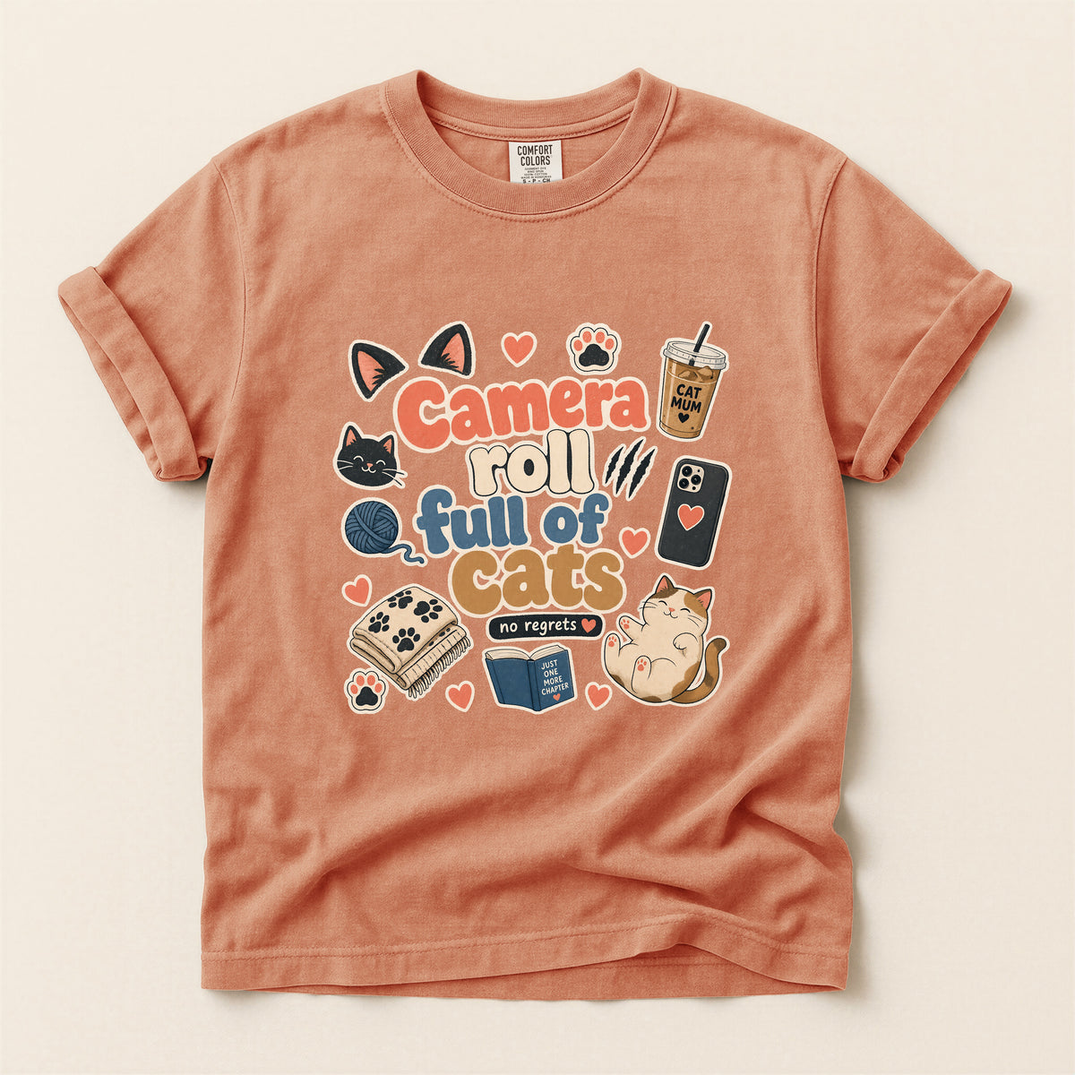 Camera Roll Full Of Cats graphic tee in Terracotta, folded flat lay