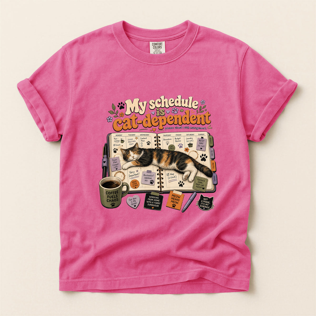 Cat Dependent Schedule graphic tee in Crunchberry, folded flat lay