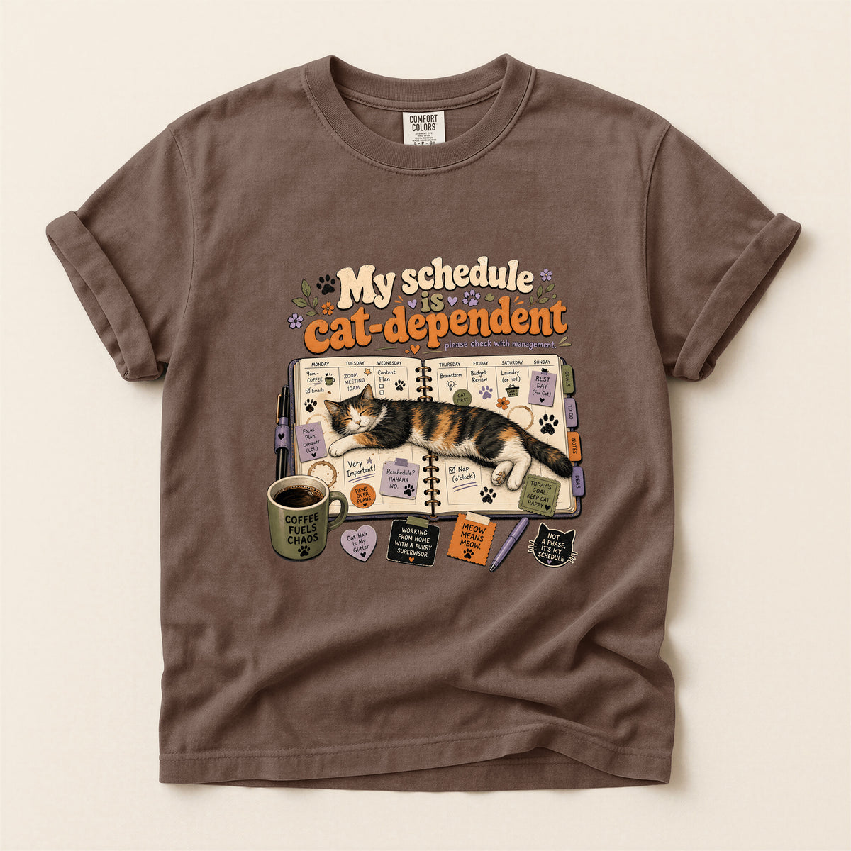 Cat Dependent Schedule graphic tee in Espresso, folded flat lay