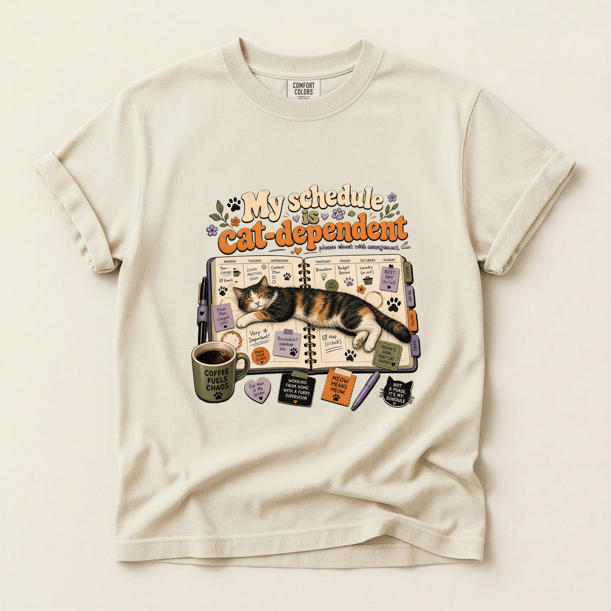 Cat Dependent Schedule graphic tee in Ivory, folded flat lay