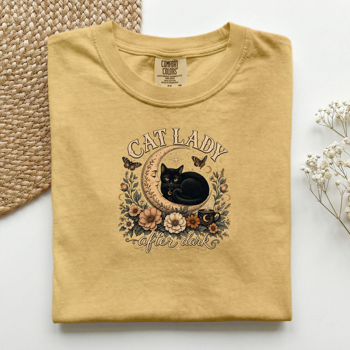Cat Lady After Dark graphic tee in Mustard, folded flat lay