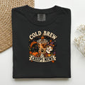 Cold Brew & Creepy Mews graphic tee in Black, folded flat lay