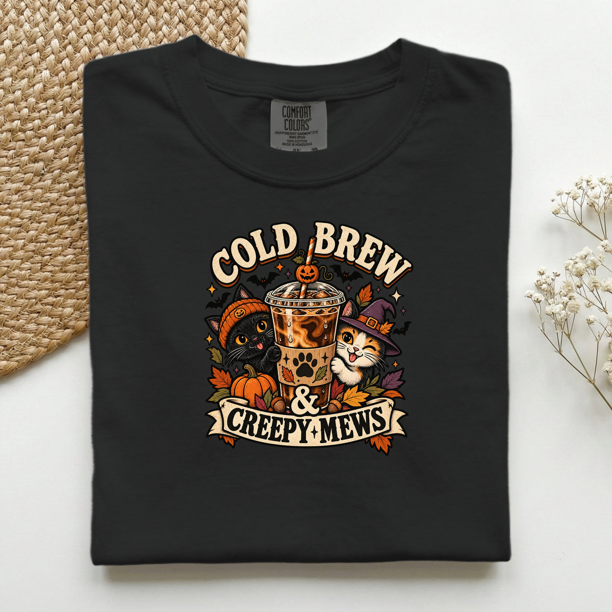 Cold Brew & Creepy Mews graphic tee in Black, folded flat lay