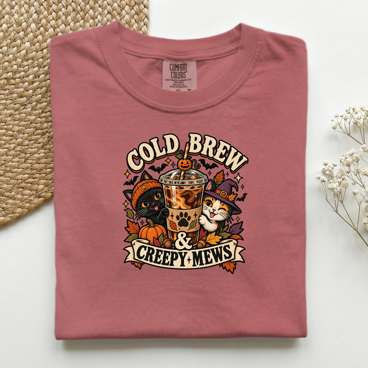 Cold Brew & Creepy Mews graphic tee in Crimson, folded flat lay