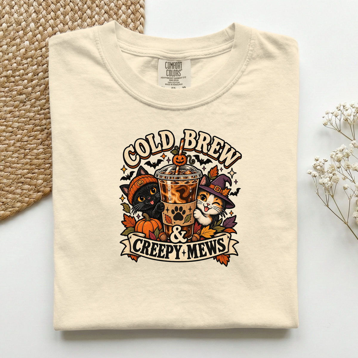 Cold Brew & Creepy Mews graphic tee in Ivory, folded flat lay