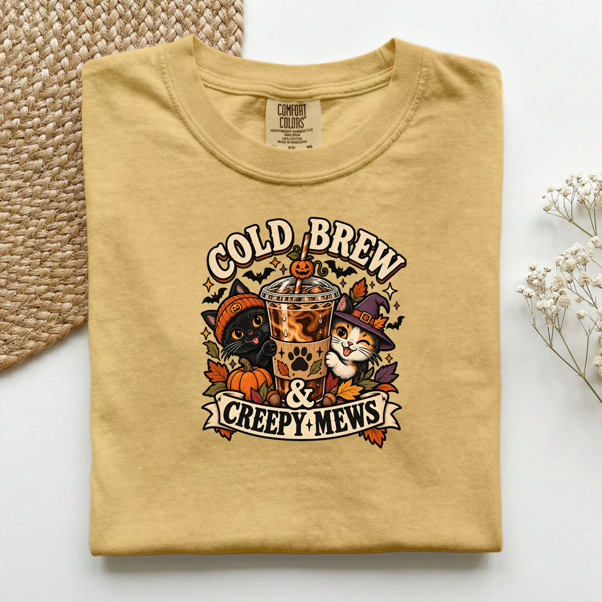 Cold Brew & Creepy Mews graphic tee in Mustard, folded flat lay