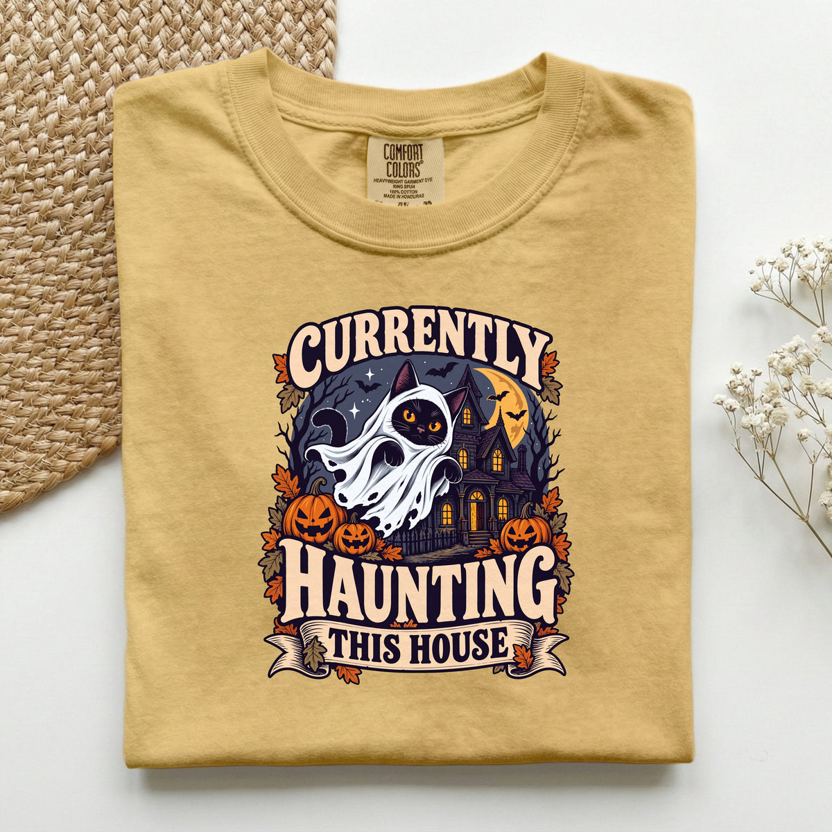 Currently Haunting This House graphic tee in Mustard, folded flat lay