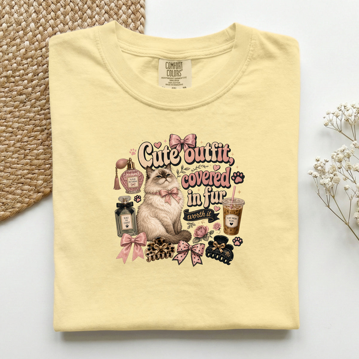 Cute Outfit Covered In Fur graphic tee in Butter, folded flat lay