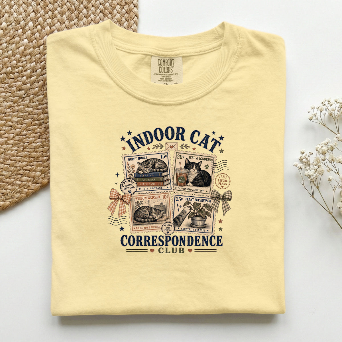 Indoor Cat Correspondence Club graphic tee in Butter, folded flat lay
