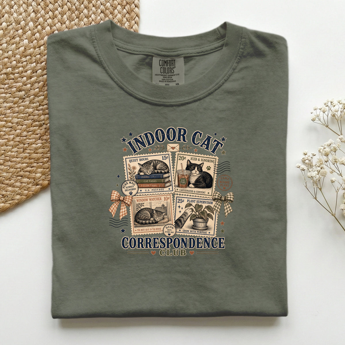 Indoor Cat Correspondence Club graphic tee in Moss, folded flat lay