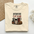 Introvert With A Cat Alibi graphic tee in Ivory, folded flat lay