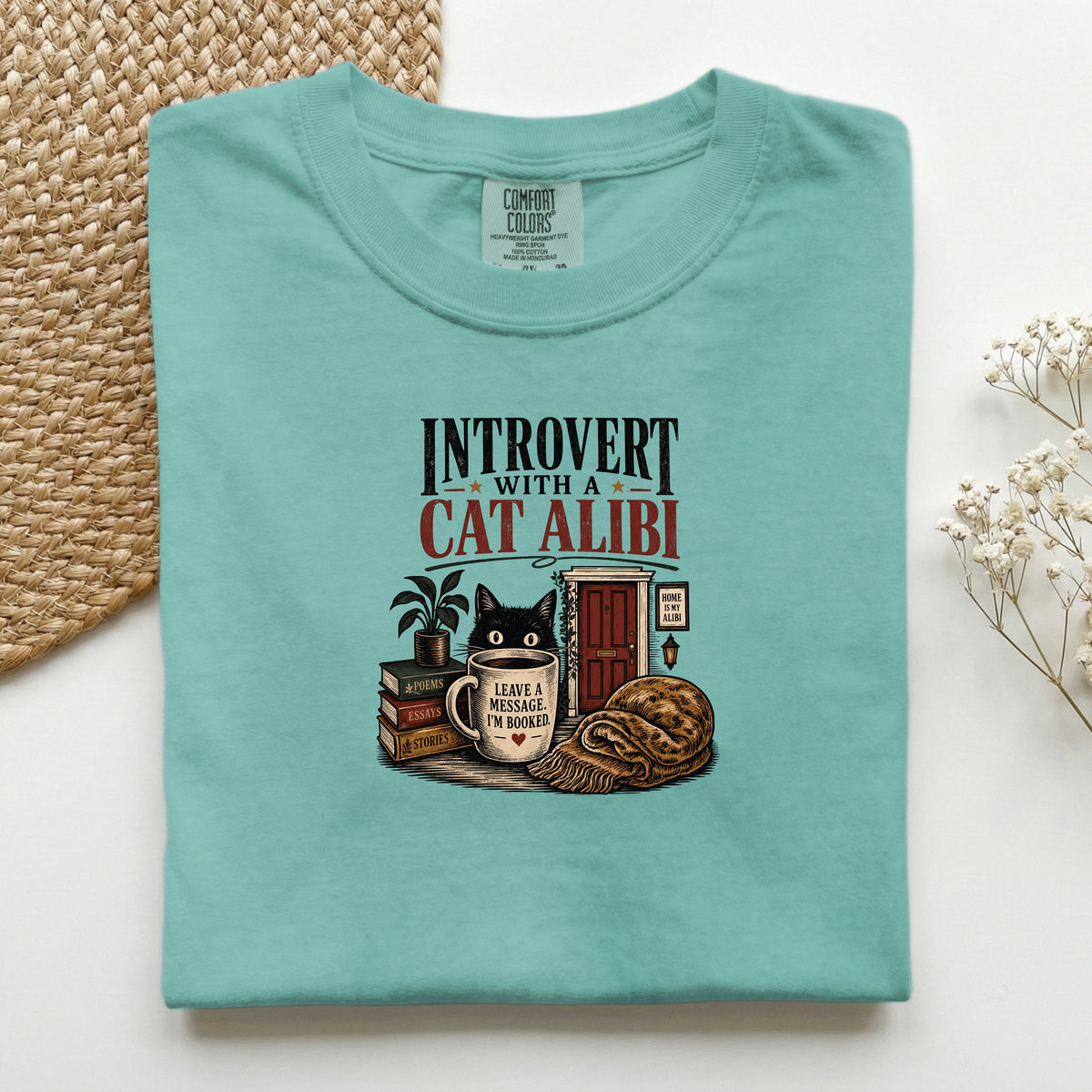 Introvert With A Cat Alibi graphic tee in Seafoam, folded flat lay