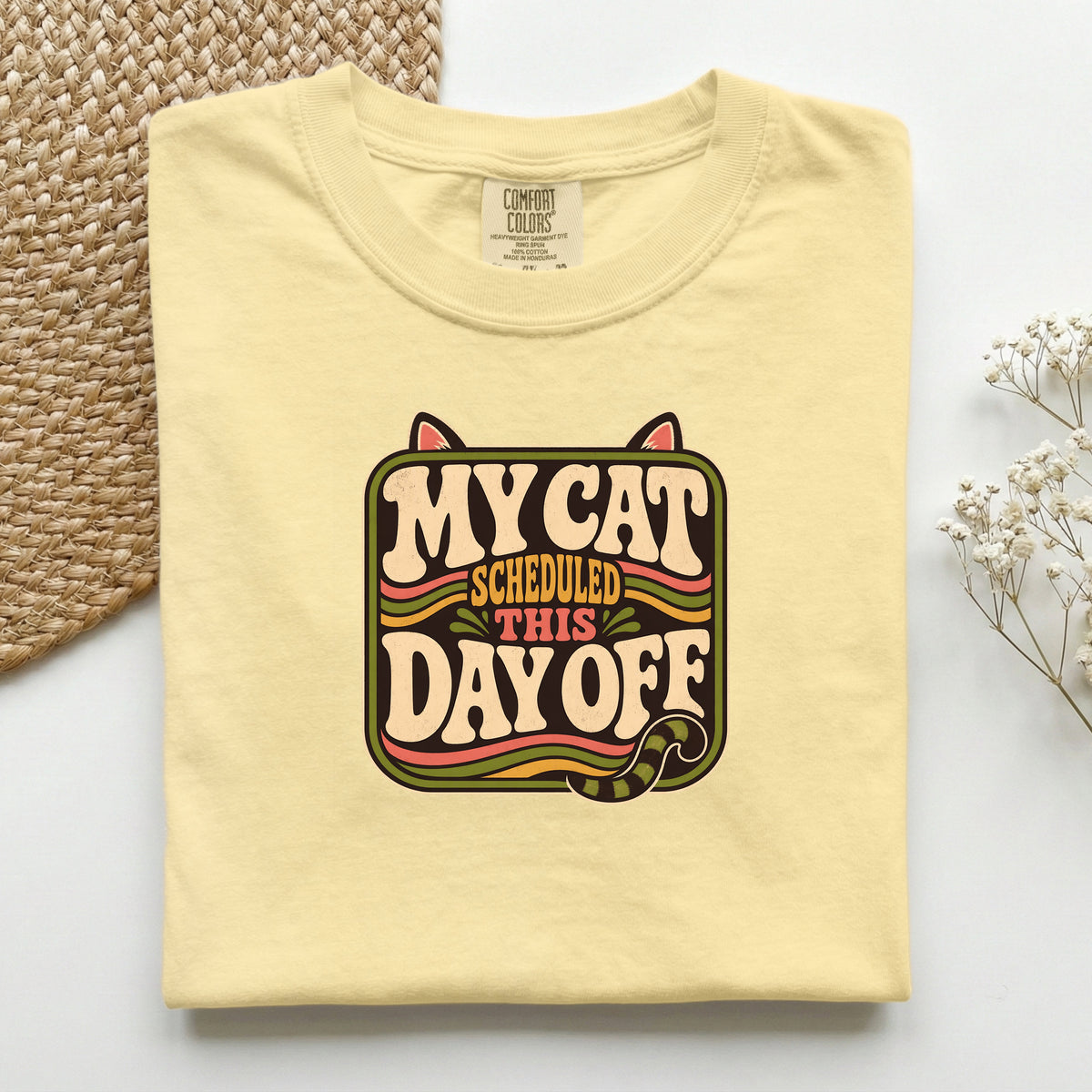 My Cat Scheduled This Day Off graphic tee in Butter, folded flat lay