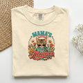 Mama's Little Menace graphic tee in Ivory, folded flat lay