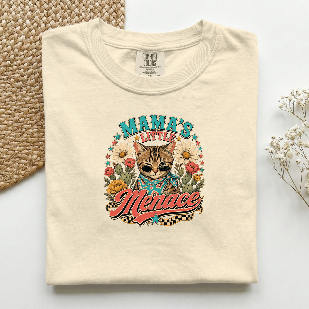 Mama's Little Menace graphic tee in Ivory, folded flat lay