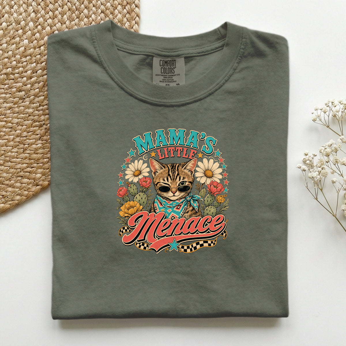 Mama's Little Menace graphic tee in Moss, folded flat lay