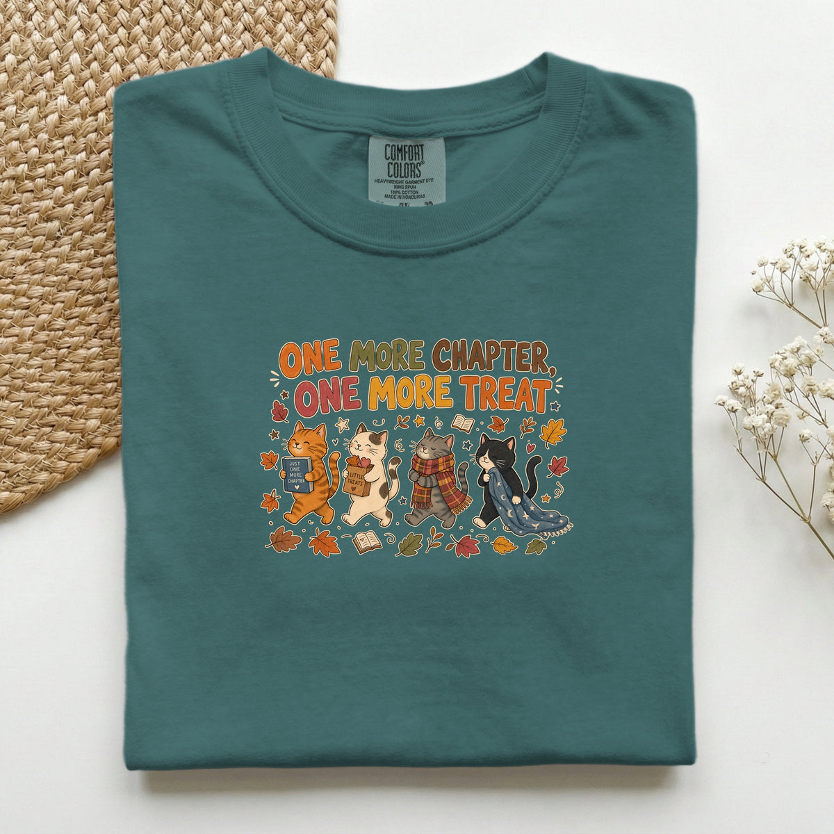 One More Chapter One More Treat graphic tee in Blue Spruce, folded flat lay