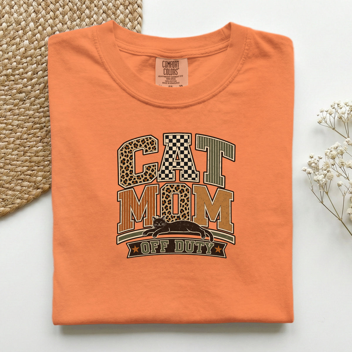 Cat Mom Off Duty graphic tee in Burnt Orange, folded flat lay