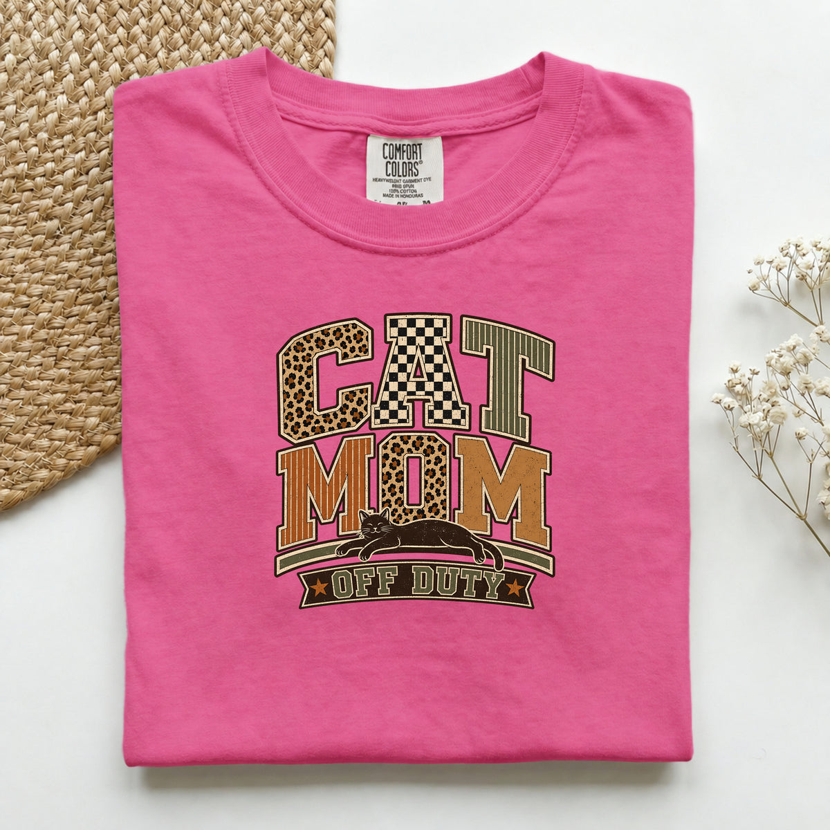 Cat Mom Off Duty graphic tee in Crunchberry, folded flat lay