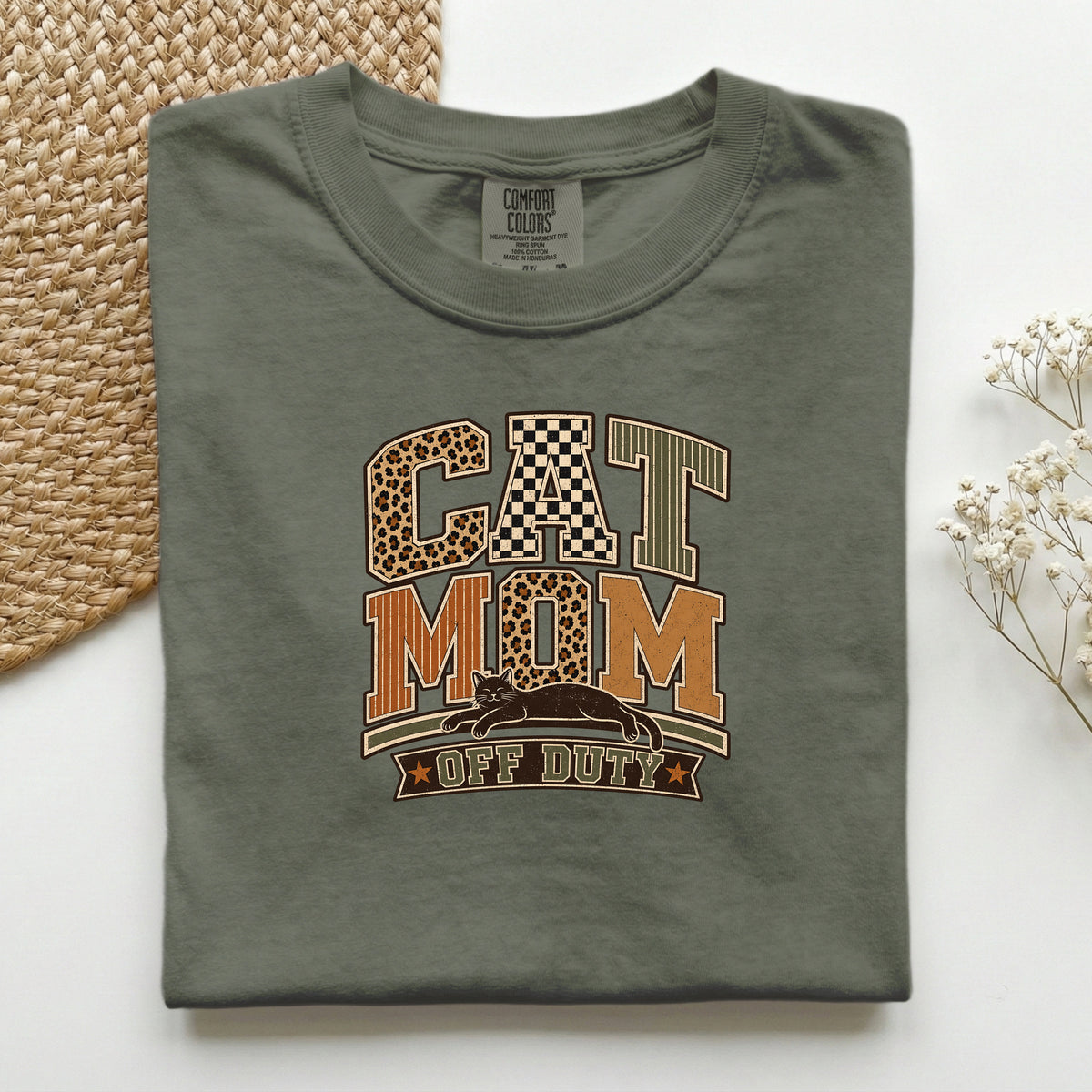 Cat Mom Off Duty graphic tee in Moss, folded flat lay