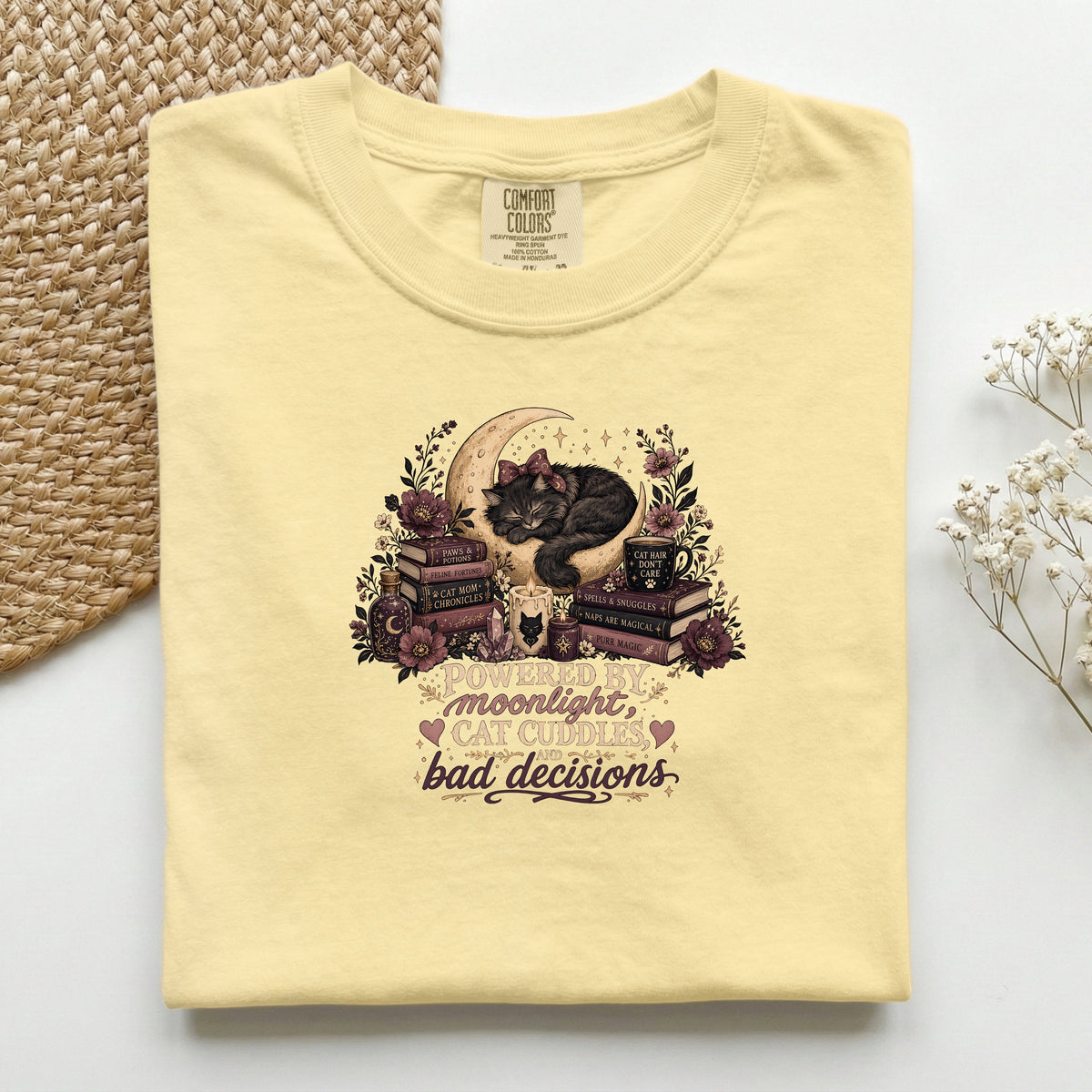 Powered By Moonlight Cat Cuddles graphic tee in Butter, folded flat lay