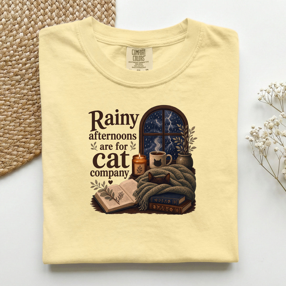 Rainy Afternoons Are For Cat Company graphic tee in Butter, folded flat lay