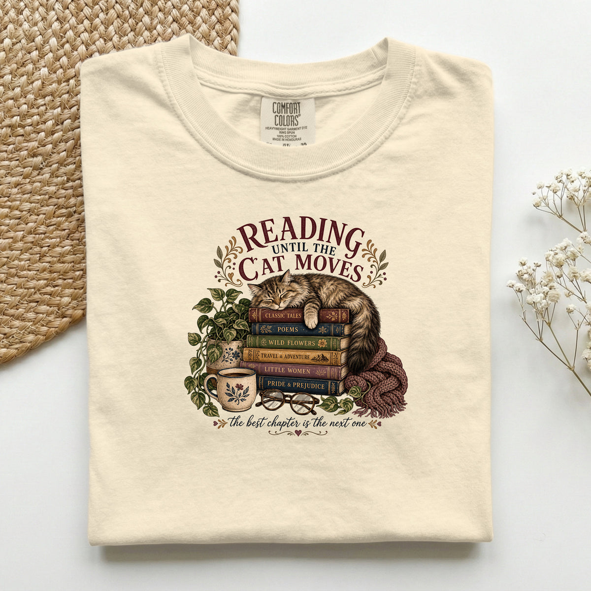Reading Until The Cat Moves graphic tee in Ivory, folded flat lay