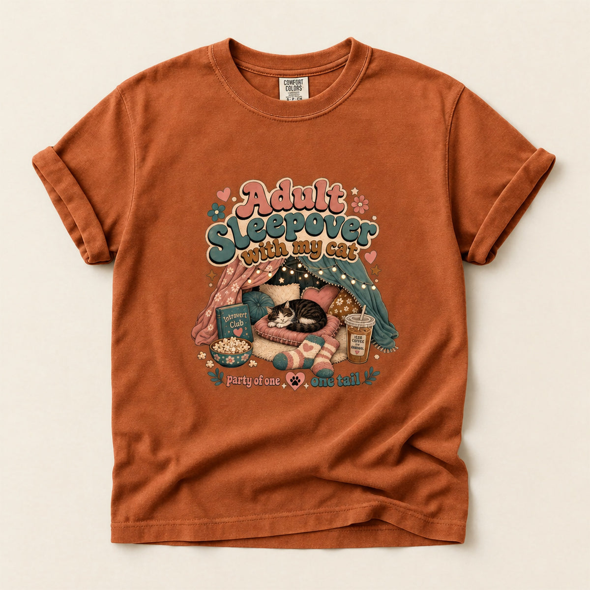 Adult Sleepover With My Cat graphic tee in Burnt Orange, folded flat lay