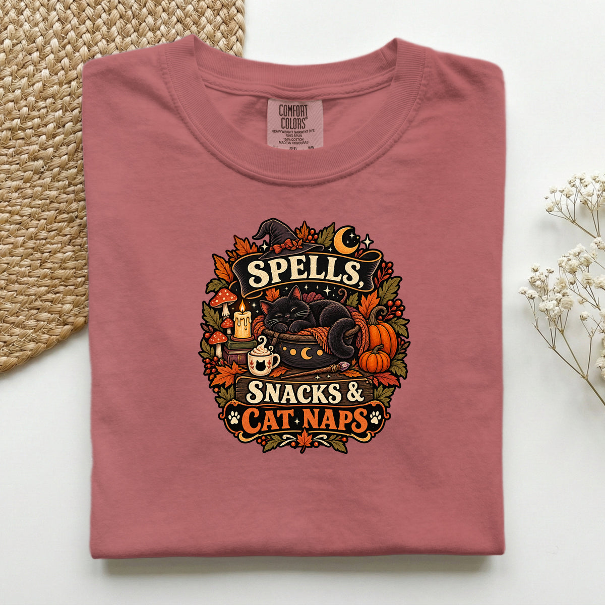 Spells Snacks & Cat Naps graphic tee in Crimson, folded flat lay