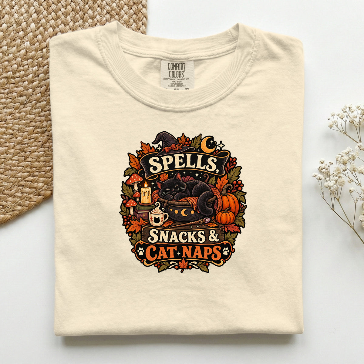 Spells Snacks & Cat Naps graphic tee in Ivory, folded flat lay
