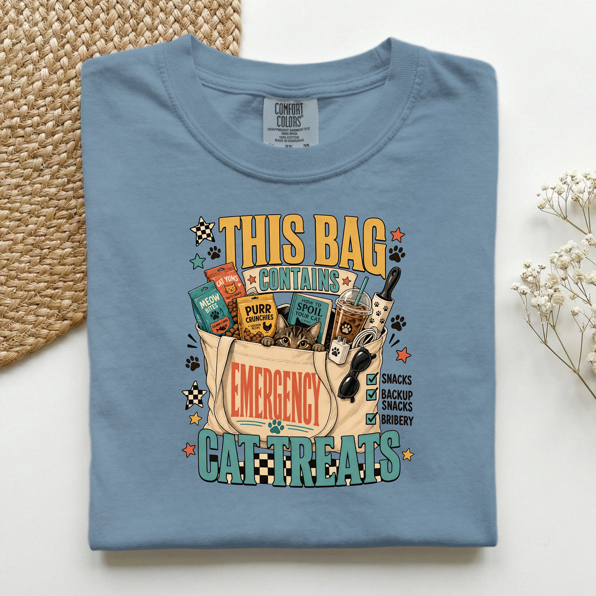 This Bag Contains Emergency Cat Treats graphic tee in Blue Jean, folded flat lay