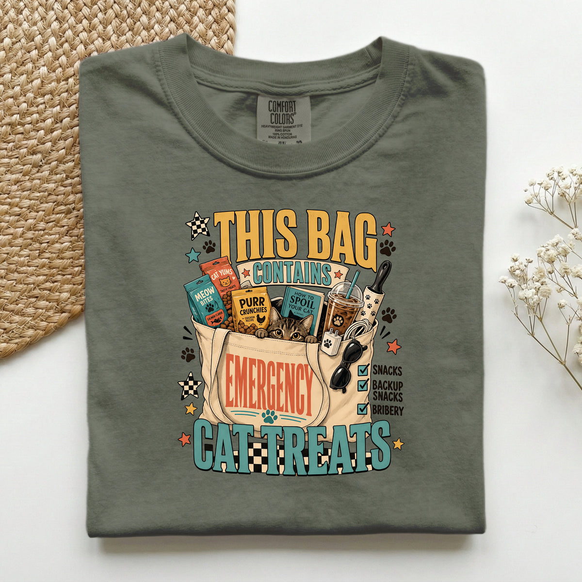 This Bag Contains Emergency Cat Treats graphic tee in Moss, folded flat lay