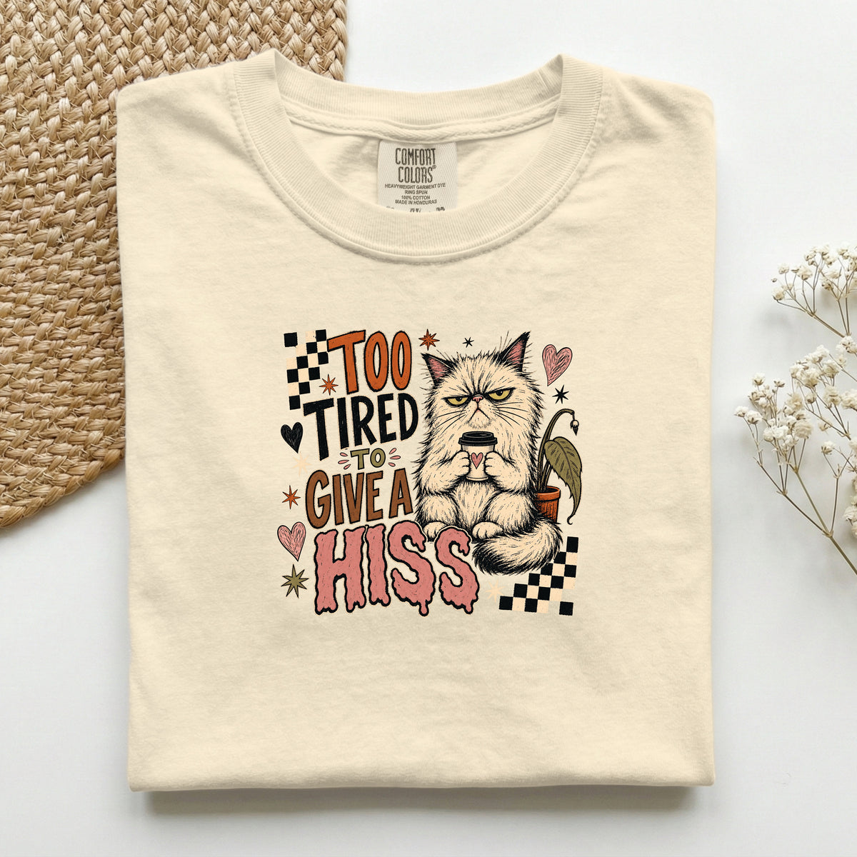Too Tired To Give A Hiss graphic tee in Ivory, folded flat lay