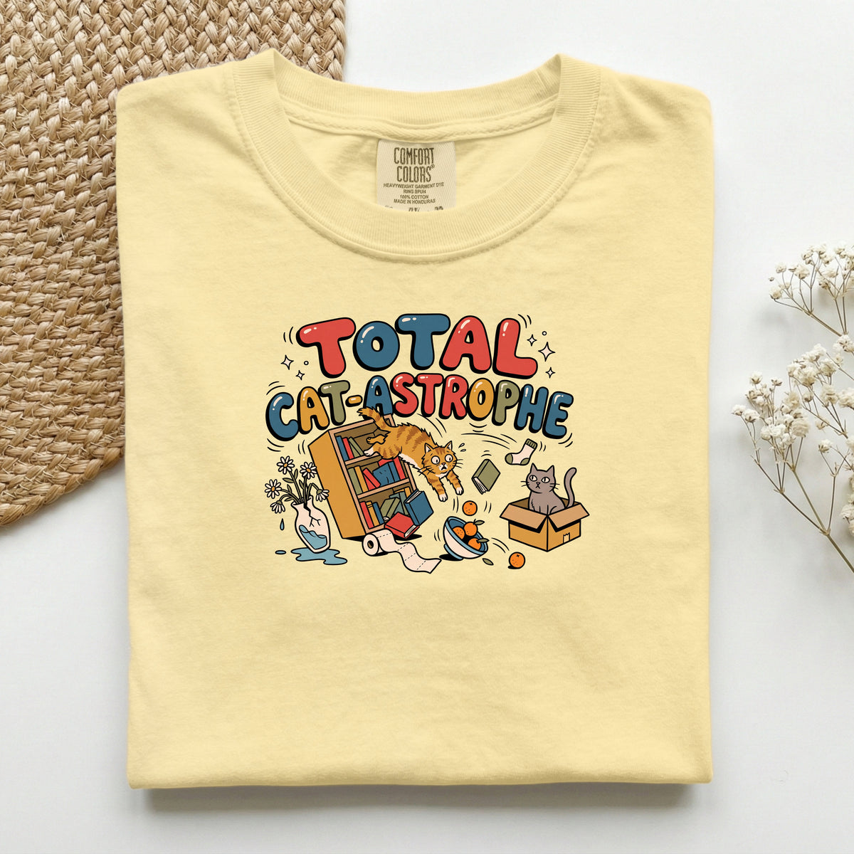Total Cat-astrophe graphic tee in Butter, folded flat lay
