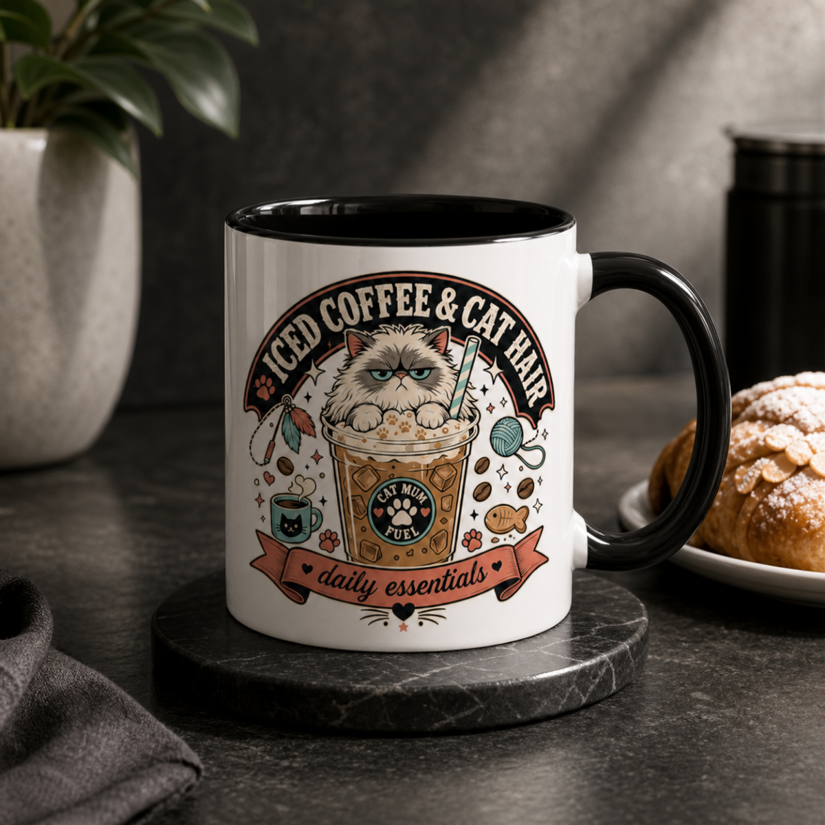 Iced Coffee & Cat Hair Cat Mum mug in Black, styled lifestyle photo with croissant