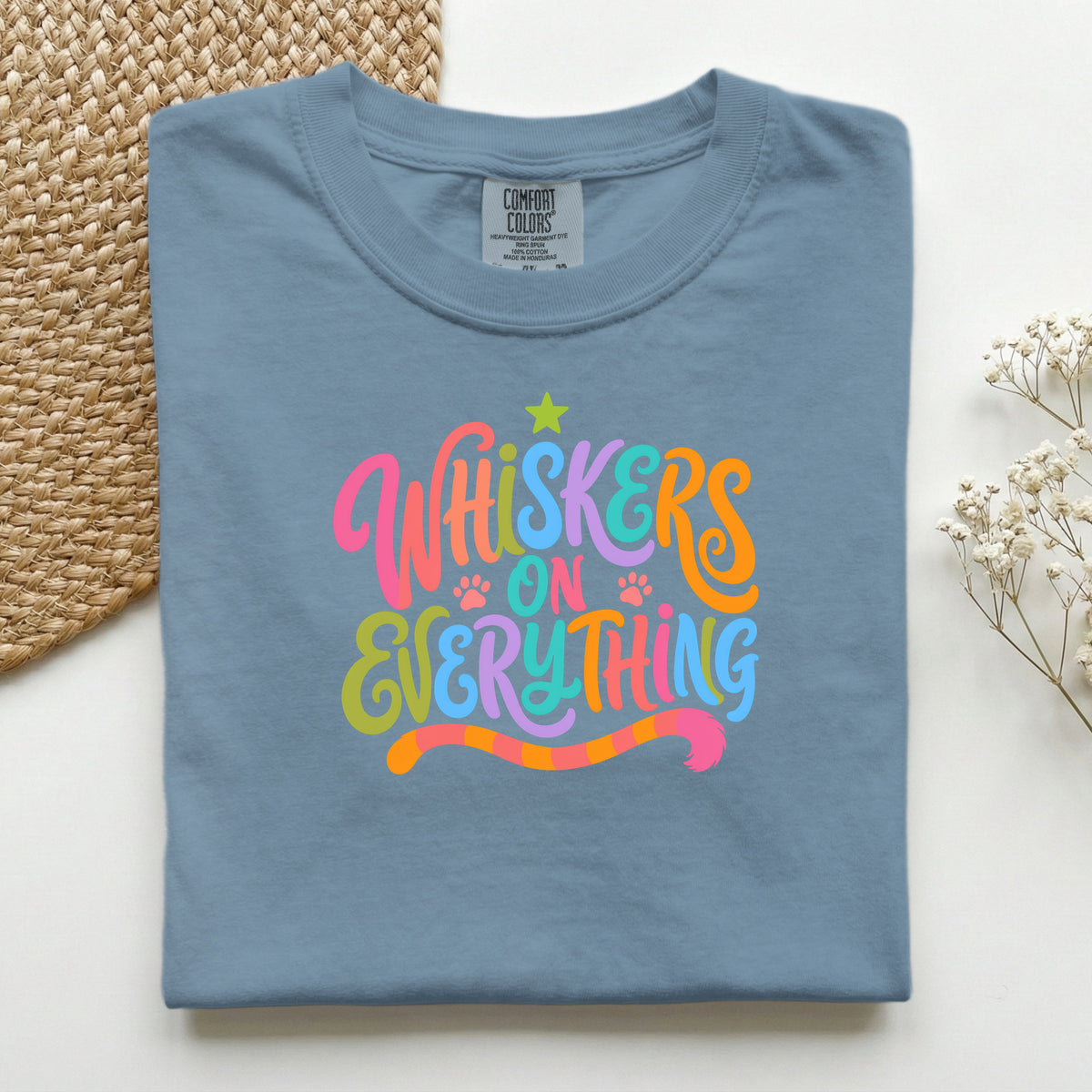 Whiskers On Everything graphic tee in Blue Jean, folded flat lay