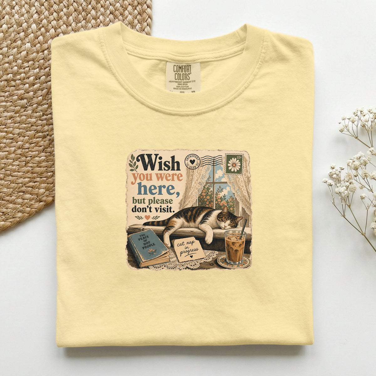 Wish You Were Here graphic tee in Butter, folded flat lay