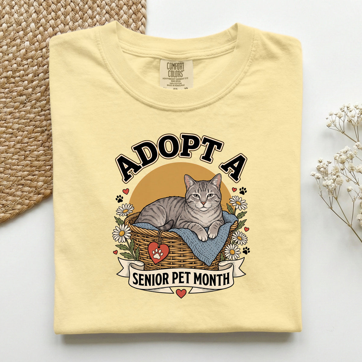 Adopt a Senior Pet Month graphic tee in Butter, folded flat lay