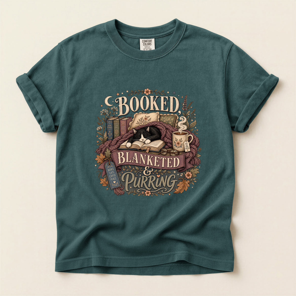 Booked Blanketed And Purring graphic tee in Blue Spruce, folded flat lay
