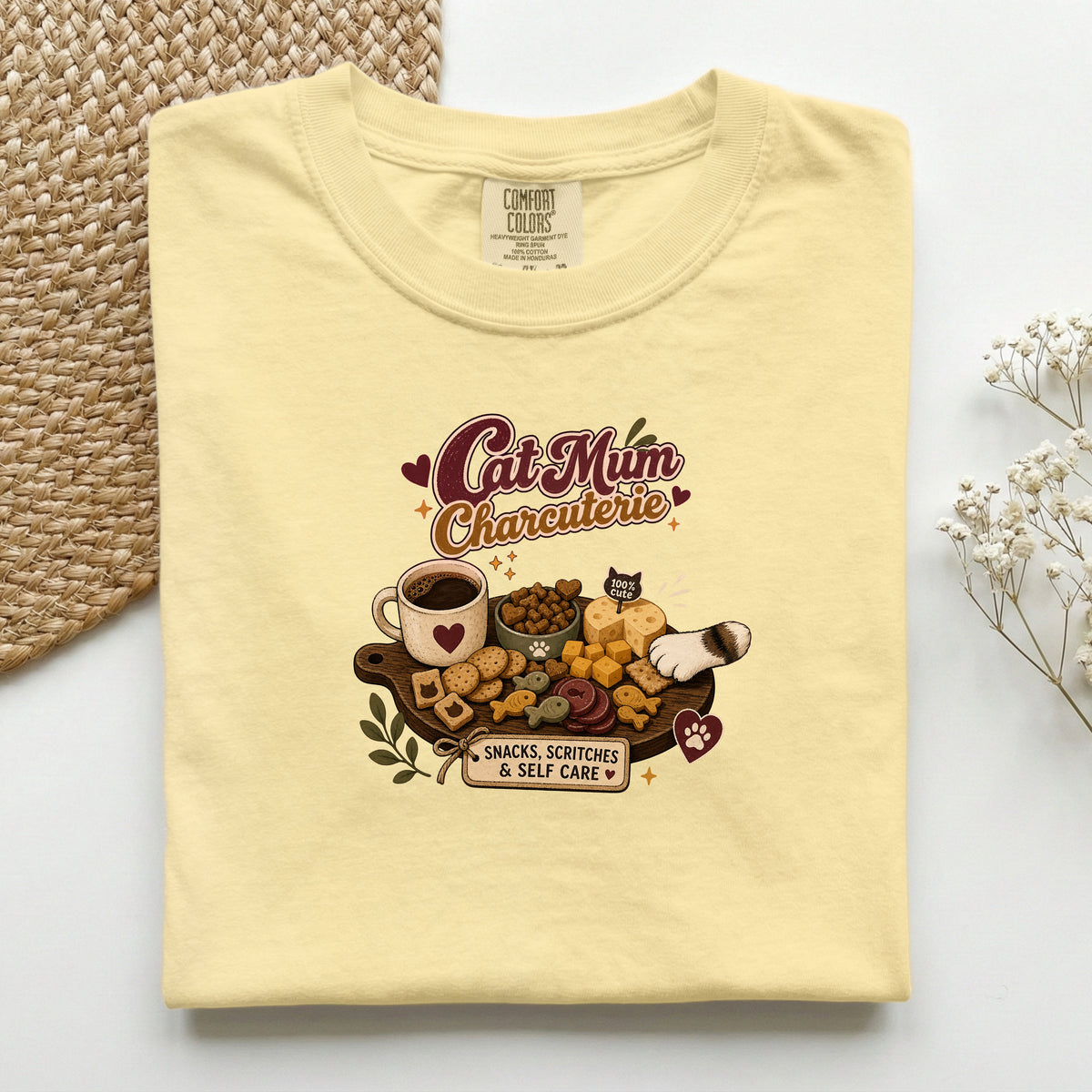 Cat Mum Charcuterie graphic tee in Butter, folded flat lay